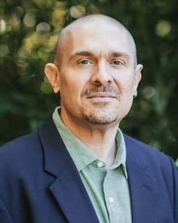 Dr. Colin J. Rhoades